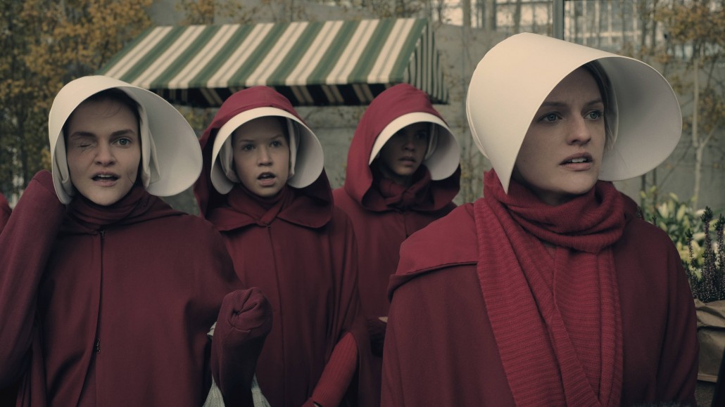 The Handmaid's Tale -- "Faithful" -- Episode 105 -- Serena Joy makes Offred a surprising proposition. Offred remembers the unconventional beginnings of her relationship with her husband. Janine (Madeline Brewer), left and Offred (Elisabeth Moss), right, shown. (Photo by: George Kraychyk/Hulu)