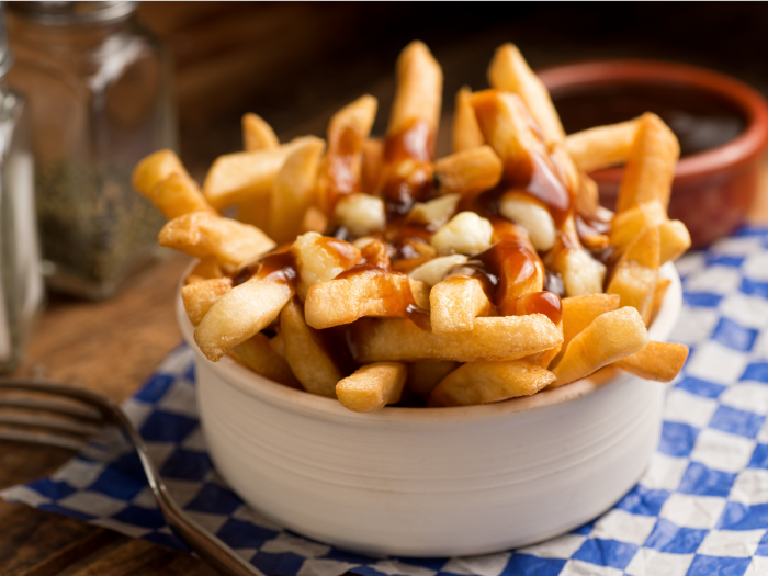 head-to-la-banquise-in-montreal-for-a-scrumptious-plate-of-poutine-crisp-french-fries-that-have-been-smothered-in-brown-gravy-and-cheese-curds-custom