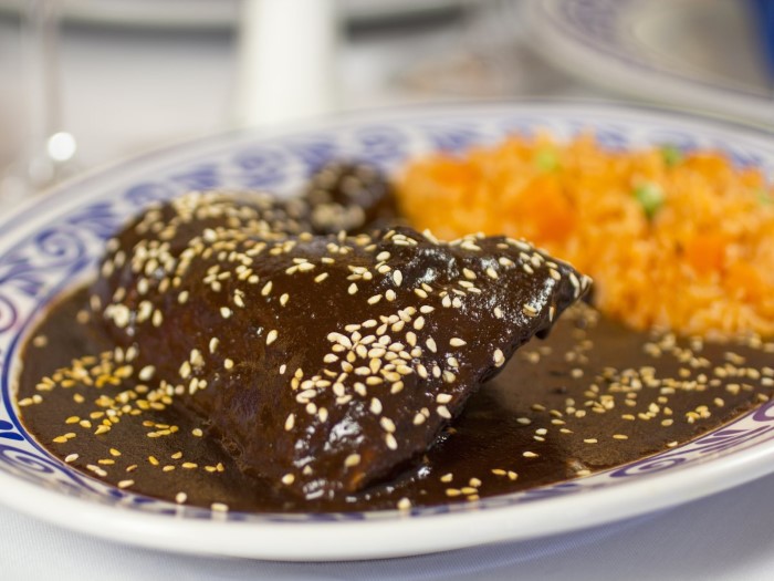 in-puebla-mexico-enjoy-the-complex-flavors-of-mole-poblano-a-thick-sauce-that-is-made-with-chili-peppers-and-chocolate-and-served-over-chicken-custom