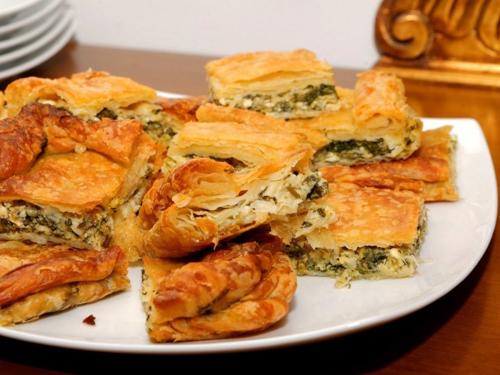 peel-off-a-crispy-flaky-layer-of-fresh-spanakopita-a-feta-and-spinach-pie-thats-served-all-over-greece-custom
