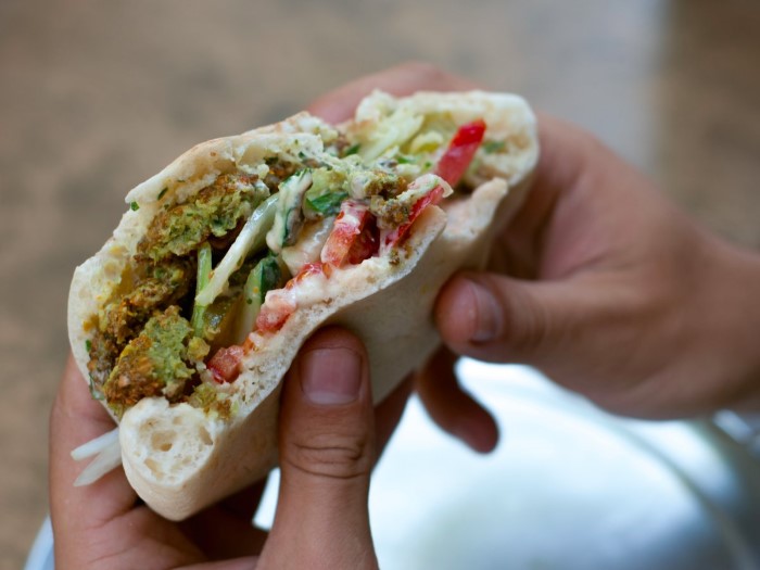 take-a-bite-out-of-a-crispy-fresh-falafel-sandwich-overstuffed-with-vegetables-in-amman-jordan-al-quds-and-abu-staif-are-some-of-the-most-famous-falafel-shops-custom