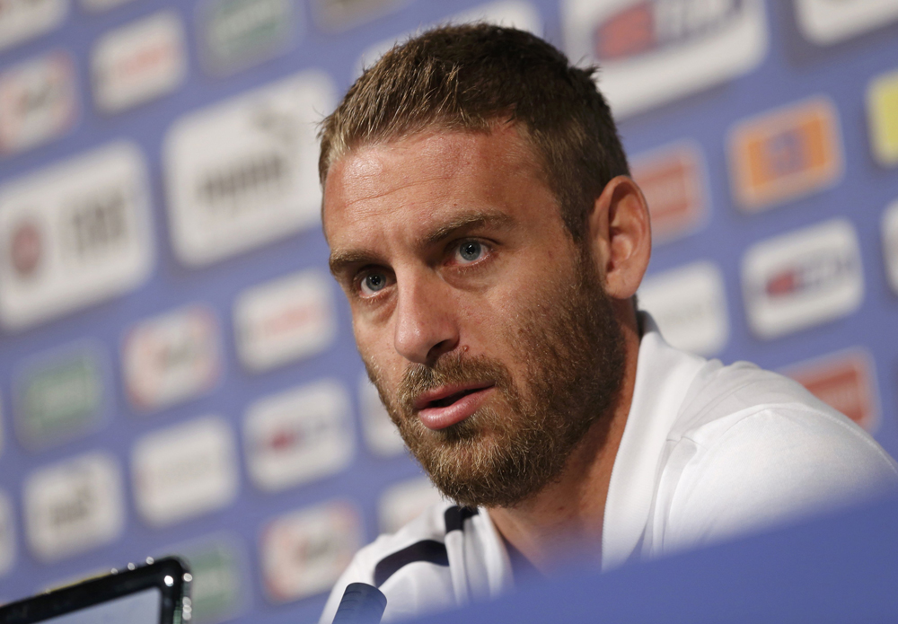 Italy's national soccer player Daniele De Rossi answers reporter's question during a news conference ahead of the Euro 2012 in Krakow June 8, 2012. REUTERS/Tony Gentile (POLAND - Tags: SPORT SOCCER)